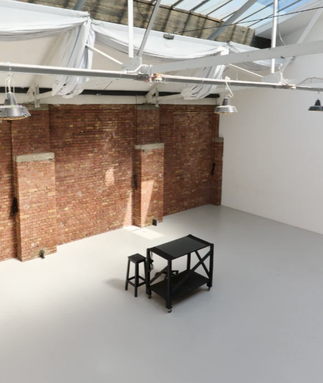 Modern wellness & yoga retreat venues in london with boardroom table and presentation screen