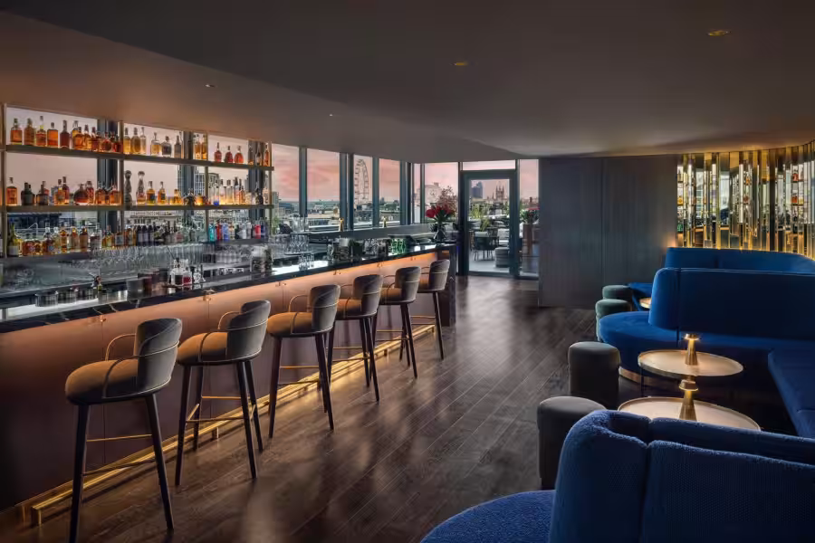 Modern corporate rooftop venues london with boardroom table and presentation screen