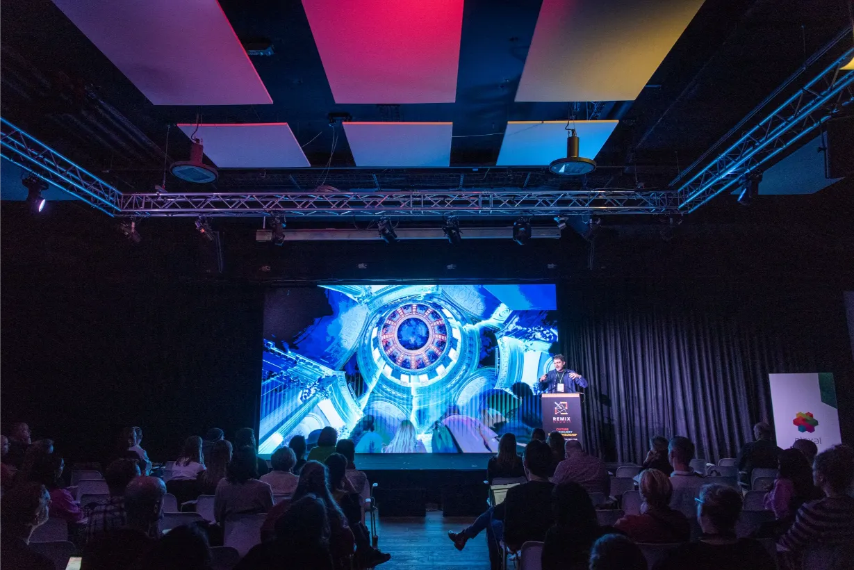 Modern multi-day event venues london with boardroom table and presentation screen