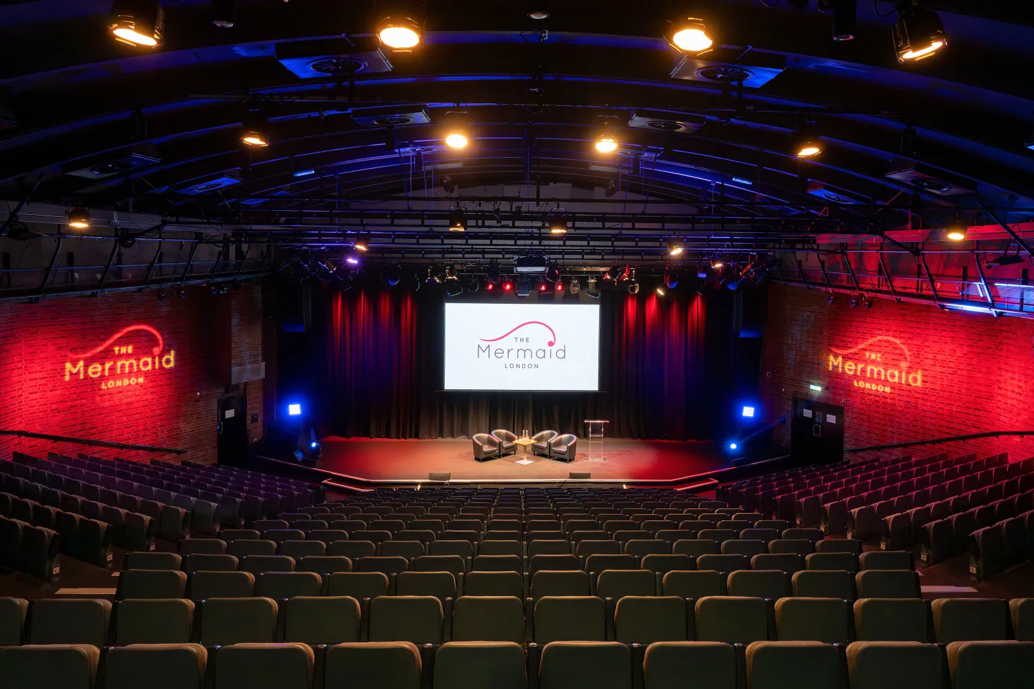 Modern panel talk venues london with boardroom table and presentation screen