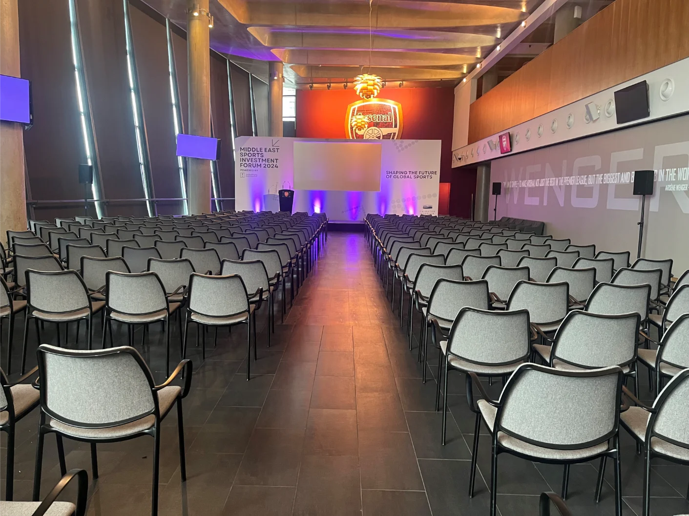 Modern conference venues london 100-200 guests with boardroom table and presentation screen